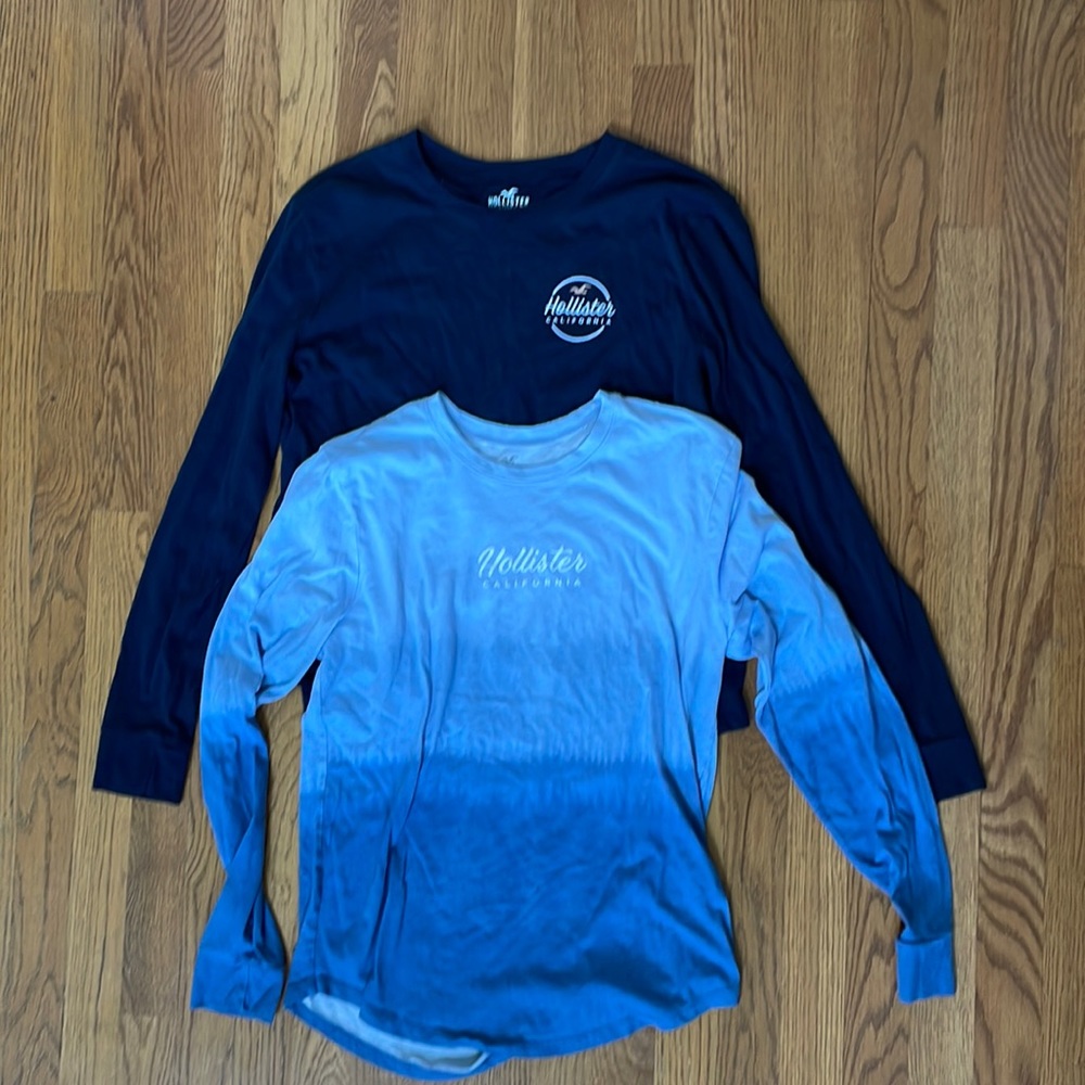 2 XS Hollister LS shirts. Navy w/wht pink and omnbre blue w/wht EUC.